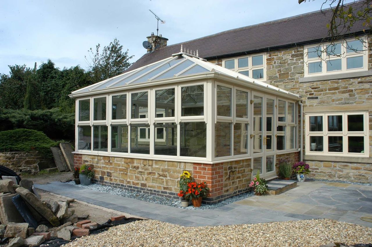 white conservatory on stone house