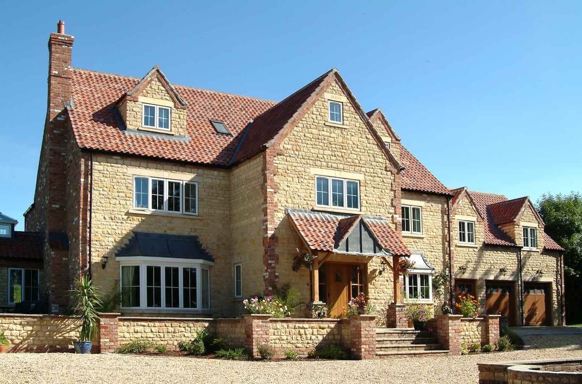 Large house with white sash windows upvc