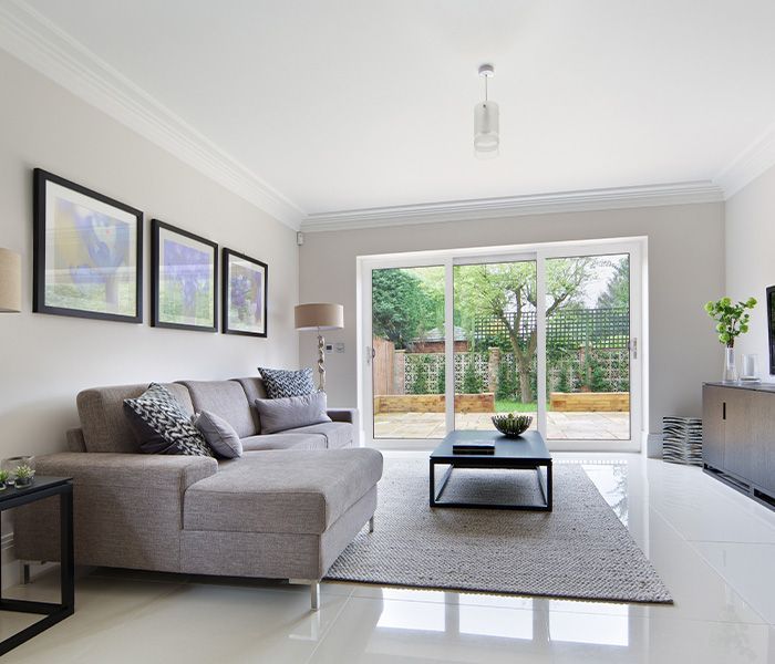 white sliding doors opening to garden