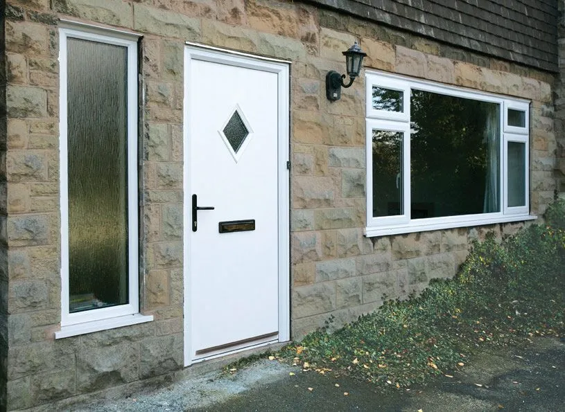 White entrance door and casement windows