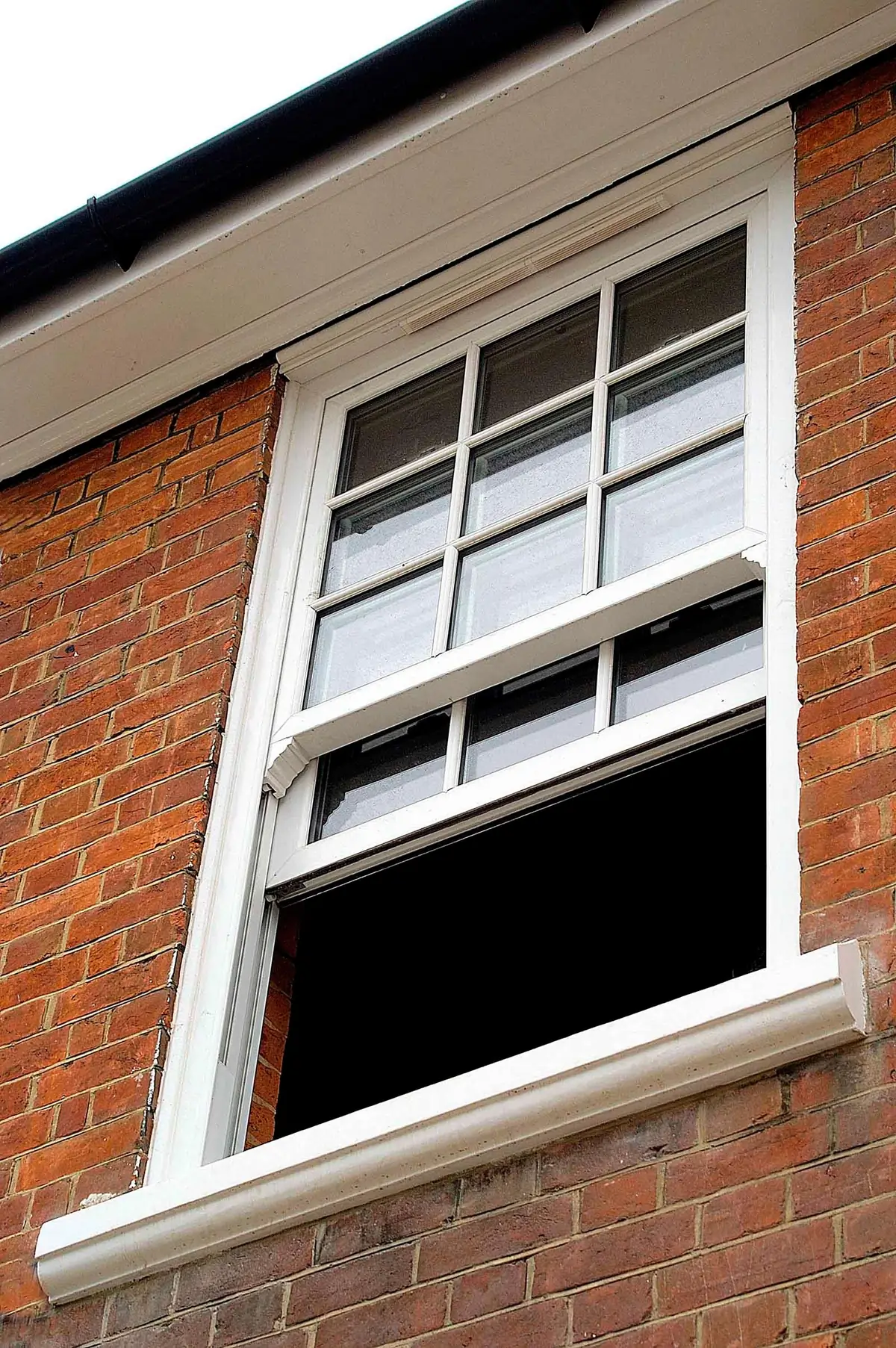 open sliding sash on red brick house